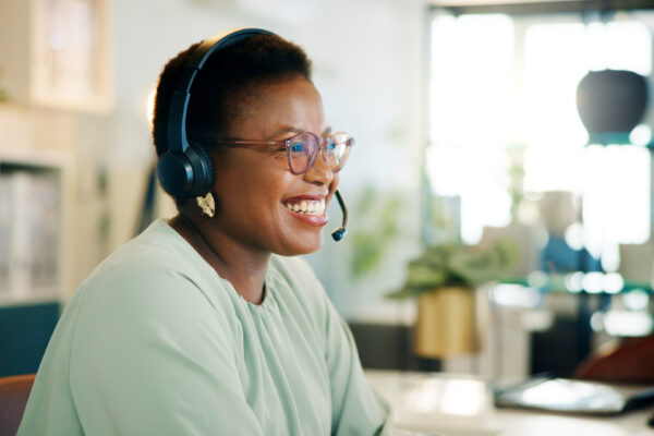 Friendly admissions specialist at an addiction treatment center offering compassionate support to incoming clients.