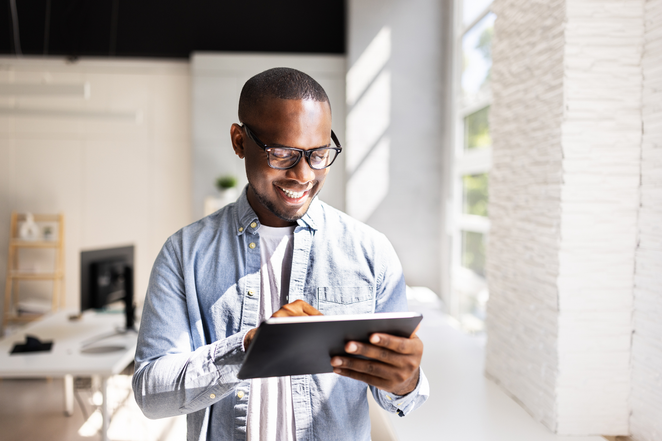 marketing professional reviewing social media paid ad performance data for treatment centers on a tablet