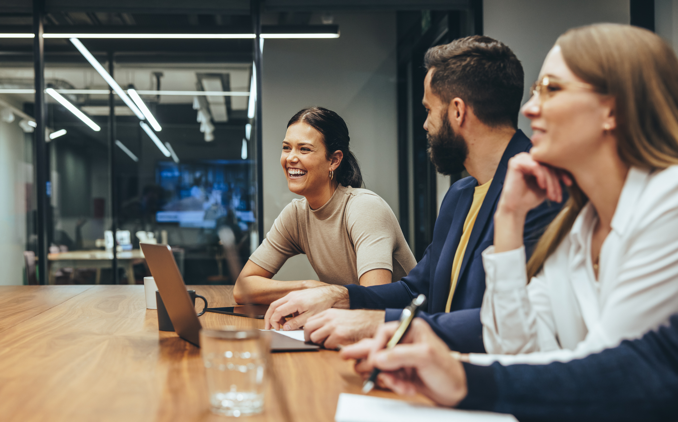 Businesswoman leading a meeting while discussing campaign strategy in a saturated PPC market