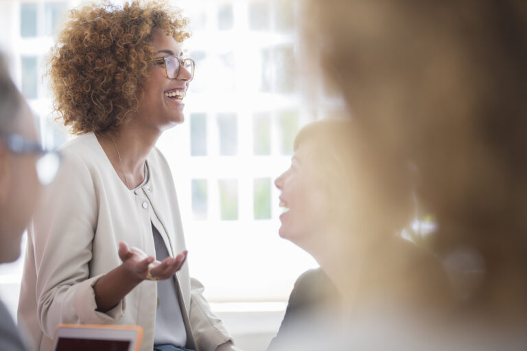 Business owner discussing Google Ads performance during a marketing strategy meeting